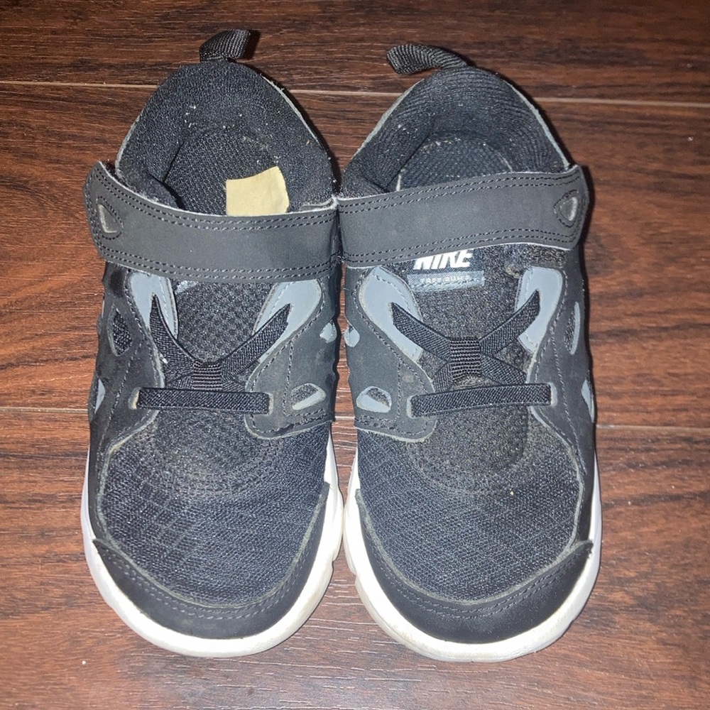 Nike Black and Gray Sneakers with Lace-Up Design and White Midsole